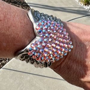 Gorgeous bracelet with crystal heart and wings. New without tags.